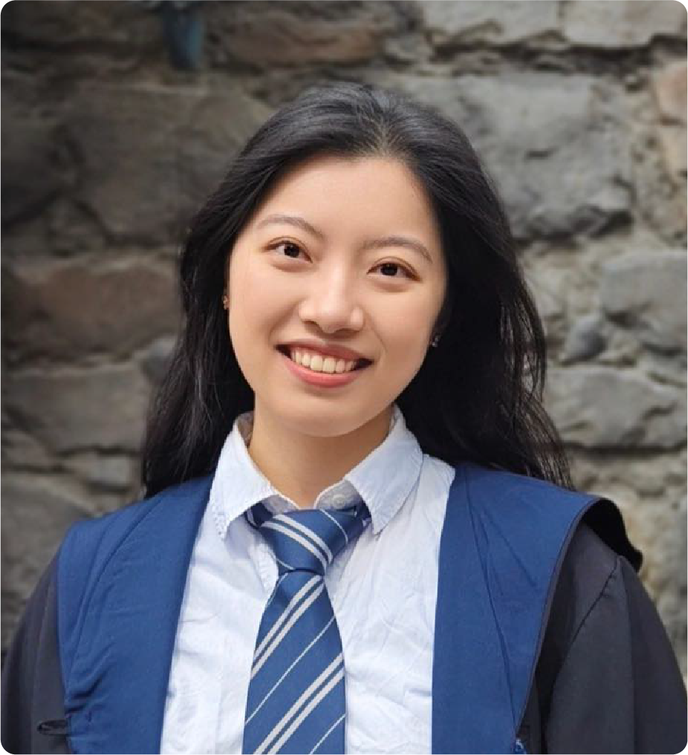 A color photo of a woman smiling for a photo.
