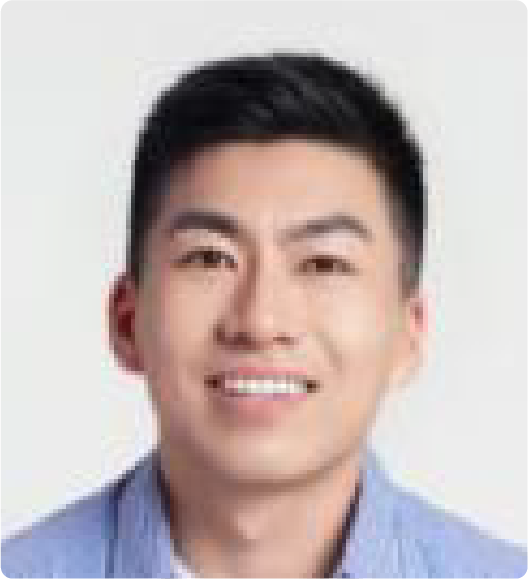 A color photo of a man smiling for a photo.