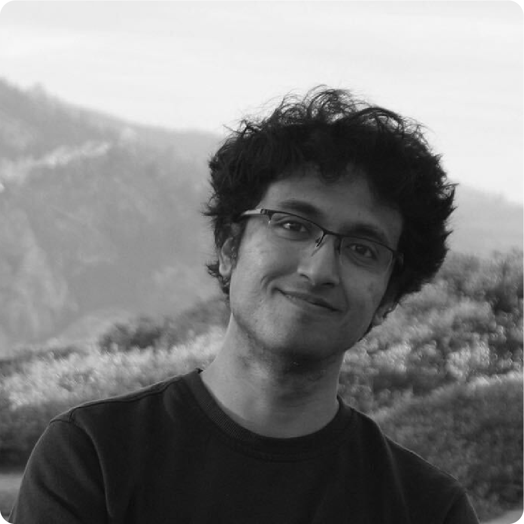 A black and white photo of a man outdoors.