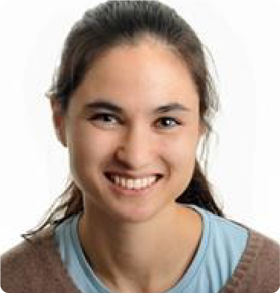 A color photo of a woman smiling for a photo.