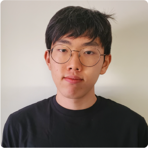 A color photo of a young man with glassses.