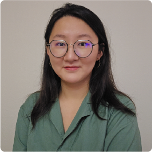 A color photo of a woman wearing glasses.