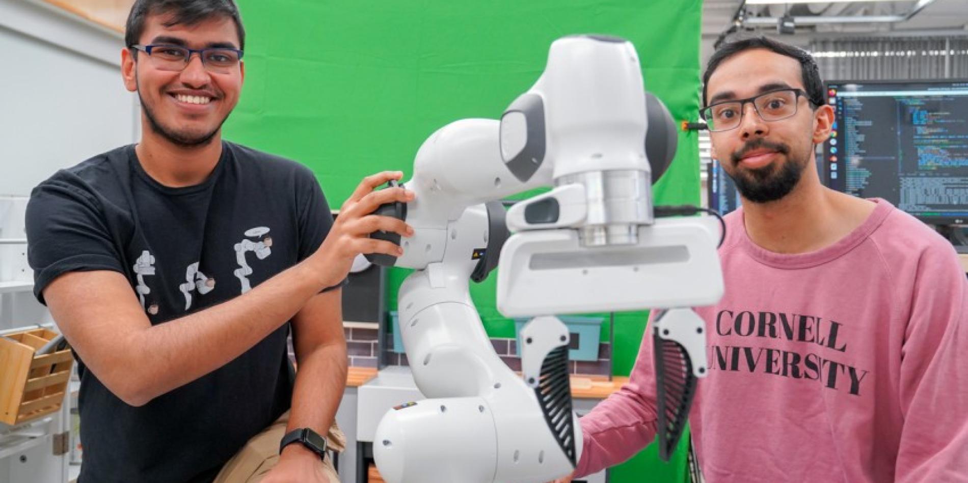 Kushal Kedia (left), a doctoral student in the field of computer science, and Prithwish Dan, M.S. ’26, are members of the development team behind RHyME, a system that allows robots to learn tasks by watching a single how-to video.