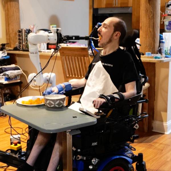 A robotic system developed by Cornell researchers feeds a man with a spinal cord injury during an in-home test.