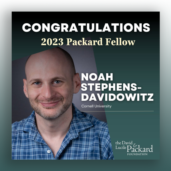 A color photo of a man smiling for a photo with text congratulating Noah Stephens-Davidowitz