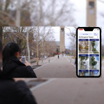 A color photo of a woman using a phone on the Cornell campus.