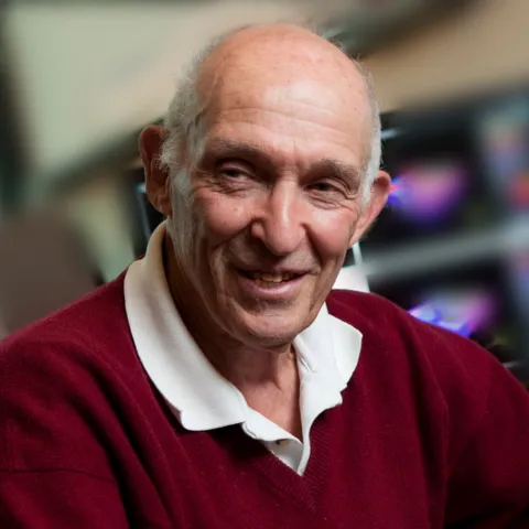 Don Greenberg in red sweater