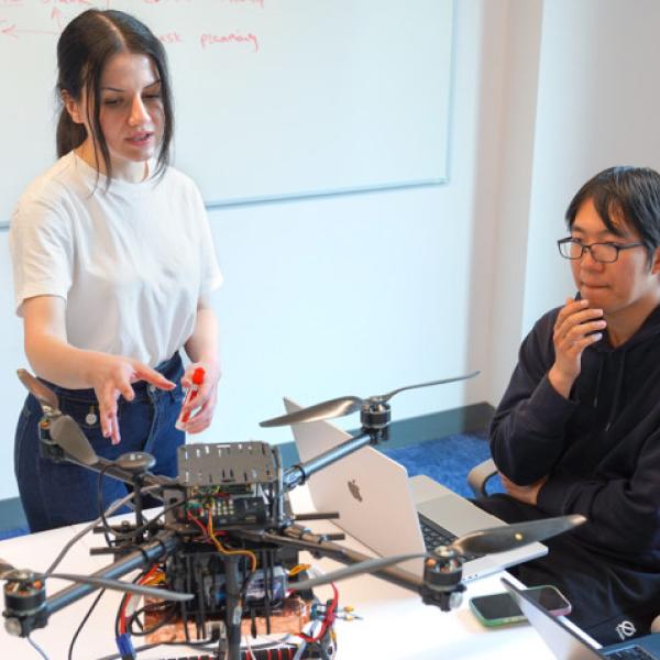 Mehrnaz Sabet, a doctoral student in the field of information science, leads a work session with graduate students assisting with Project Orion, an autonomous airspace coordination system she’s developing at Cornell.