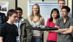 Student demonstrates his robotics research with a flying quadcopter