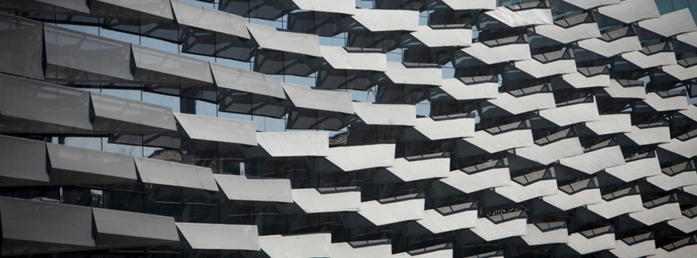 gray metal fins layered on the side of Gates Hall